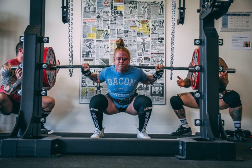 Woman squatting heavy in competition